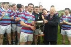 Chairman-Carbery-Board-Joe-Crowley-presents-the-Matt-Margaret-O-Sullivan-Cup-to-Daniel-Hurley-Captain-of-Ibane-Gaels
